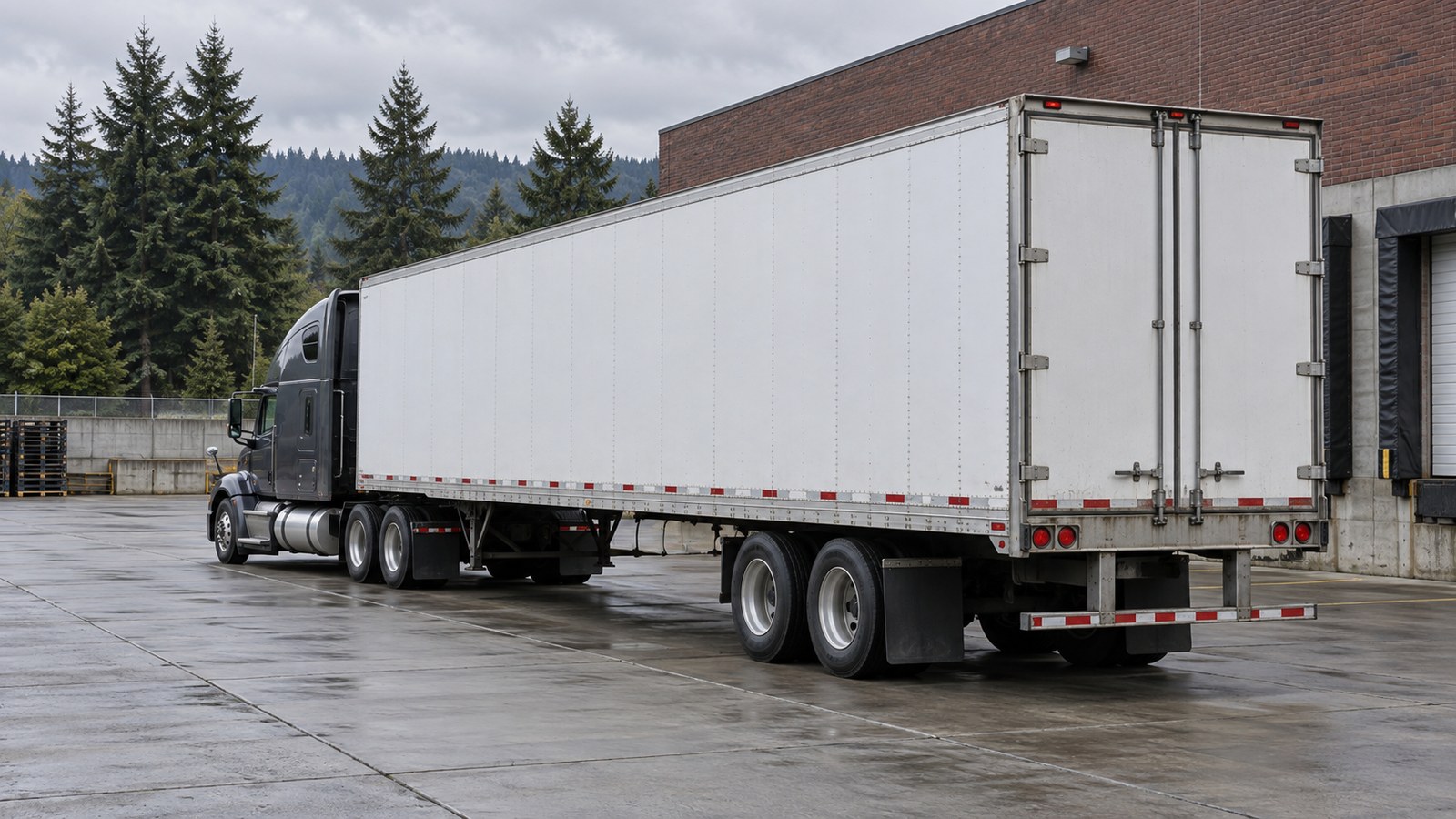 Illustrative rear three-quarter view of a tractor-trailer at a Portland-like industrial yard